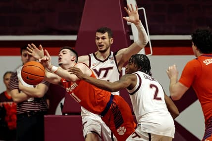 Jan 10, 2024; Blacksburg, Virginia, USA; Virginia Tech Hokies guard MJ Collins (2) knocks the ball away from Clemson Tigers guard Joseph Girard III (11) during the second half at Cassell Coliseum. Mandatory Credit: Peter Casey-USA TODAY Sports