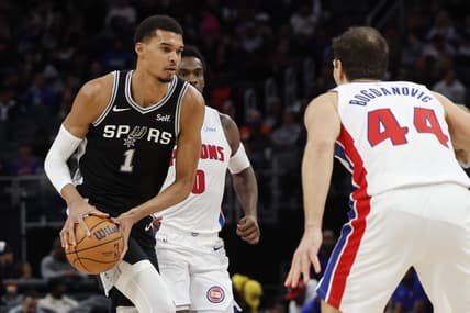 Jan 10, 2024; Detroit, Michigan, USA;  San Antonio Spurs center Victor Wembanyama (1) dribbles defended by Detroit Pistons forward Bojan Bogdanovic (44) in the first half at Little Caesars Arena. Mandatory Credit: Rick Osentoski-USA TODAY Sports
