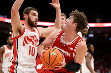 Jan 10, 2024; Columbus, Ohio, USA; Wisconsin Badgers guard Max Klesmit (11) looks for the shot as Ohio State Buckeyes forward Jamison Battle (10) defends during the first half at Value City Arena. Mandatory Credit: Joseph Maiorana-USA TODAY Sports