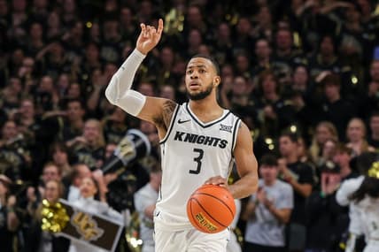 Jan 10, 2024; Orlando, Florida, USA; UCF Knights guard Darius Johnson (3) signals to teammates as he brings the ball up court during the second half against the Kansas Jayhawks at Addition Financial Arena. Mandatory Credit: Mike Watters-USA TODAY Sports