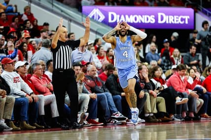 Jan 10, 2024; Raleigh, North Carolina, USA;  North Carolina Tar Heels guard RJ Davis (4) reacts after scoring during the second half against North Carolina State Wolfpack at PNC Arena. Mandatory Credit: Jaylynn Nash-USA TODAY Sports