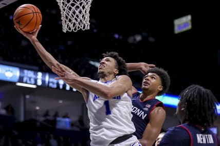Jan 10, 2024; Cincinnati, Ohio, USA; Xavier Musketeers guard Desmond Claude (1) shoots against Connecticut Huskies forward Jaylin Stewart (3) in the second half at Cintas Center. Mandatory Credit: Katie Stratman-USA TODAY Sports