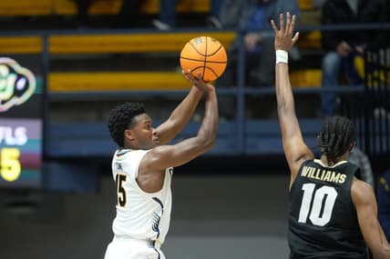 Jan 10, 2024; Berkeley, California, USA; California Golden Bears guard Jalen Cone (15) shoots against Colorado Buffaloes forward Cody Williams (10) during the first half at Haas Pavilion. Mandatory Credit: Darren Yamashita-USA TODAY Sports