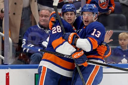 Jan 11, 2024; Elmont, New York, USA; New York Islanders defenseman Alexander Romanov (28) celebrates his goal against the Toronto Maple Leafs with center Mathew Barzal (13) during the second period at UBS Arena. Mandatory Credit: Brad Penner-USA TODAY Sports
