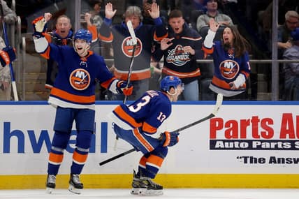 Jan 11, 2024; Elmont, New York, USA; New York Islanders center Mathew Barzal (13) celebrates his game winning goal against the Toronto Maple Leafs with defenseman Noah Dobson (8) during overtime at UBS Arena. Mandatory Credit: Brad Penner-USA TODAY Sports