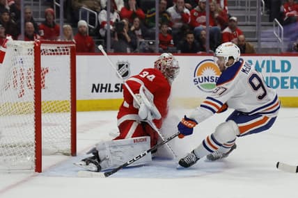 Jan 11, 2024; Detroit, Michigan, USA;  Edmonton Oilers center Connor McDavid (97) scores on Detroit Red Wings goaltender Alex Lyon (34) in the third period at Little Caesars Arena. Mandatory Credit: Rick Osentoski-USA TODAY Sports