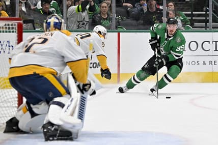 Jan 12, 2024; Dallas, Texas, USA; Nashville Predators goaltender Kevin Lankinen (32) faces a shot by Dallas Stars center Matt Duchene (95) during the second period at the American Airlines Center. Mandatory Credit: Jerome Miron-USA TODAY Sports