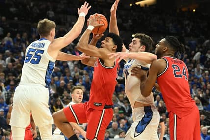 Jan 13, 2024; Omaha, Nebraska, USA;  Creighton Bluejays guard Baylor Scheierman (55) and center Ryan Kalkbrenner (11) defend against St. John's Red Storm guard RJ Luis Jr. (12) in the first half at CHI Health Center Omaha. Mandatory Credit: Steven Branscombe-USA TODAY Sports