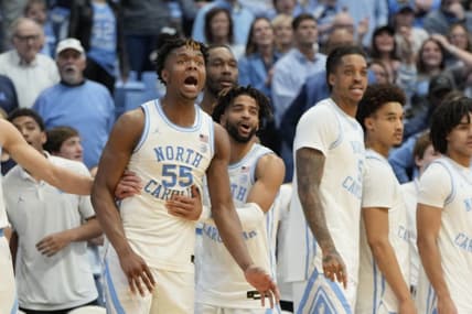 Jan 13, 2024; Chapel Hill, North Carolina, USA;  North Carolina Tar Heels bench including forward Harrison Ingram (55) and guard RJ Davis (4) and forward Armando Bacot (5) and guard Seth Trimble (7) celebrate in the second half at Dean E. Smith Center. Mandatory Credit: Bob Donnan-USA TODAY Sports