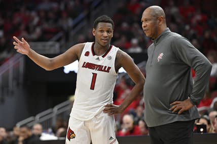 Jan 13, 2024; Louisville, Kentucky, USA;  Louisville Cardinals guard Curtis Williams (1) talks with head coach Kenny Payne during the second half against the North Carolina State Wolfpack at KFC Yum! Center. Mandatory Credit: Jamie Rhodes-USA TODAY Sports
