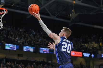 Jan 13, 2024; Orlando, Florida, USA; Brigham Young Cougars guard Spencer Johnson (20) goes to the basket during the first period against the UCF Knights at Addition Financial Arena. Mandatory Credit: Mike Watters-USA TODAY Sports