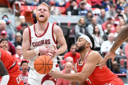 Jan 13, 2024; Pullman, Washington, USA; Arizona Wildcats guard Kylan Boswell (4) strips the ball away from Washington State Cougars guard Jabe Mullins (3) in the first half at Friel Court at Beasley Coliseum. Mandatory Credit: James Snook-USA TODAY Sports