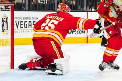 Jan 13, 2024; Las Vegas, Nevada, USA; Calgary Flames goaltender Jacob Markstrom (25) blocks a shot by the Vegas Golden Knights during the second period at T-Mobile Arena. Mandatory Credit: Stephen R. Sylvanie-USA TODAY Sports
