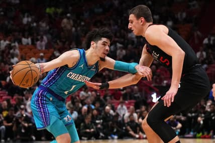 Jan 14, 2024; Miami, Florida, USA; Charlotte Hornets guard LaMelo Ball (1) drives the ball around Miami Heat forward Nikola Jovic (5) during the first half at Kaseya Center. Mandatory Credit: Jasen Vinlove-USA TODAY Sports