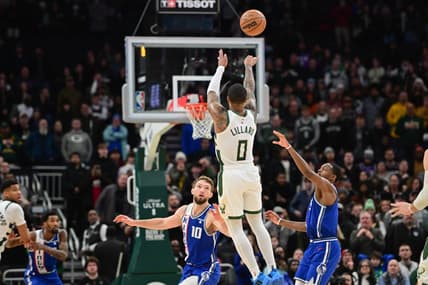 Jan 14, 2024; Milwaukee, Wisconsin, USA; Milwaukee Bucks guard Damian Lillard (0) scores the game-winning three-point basket at the end of overtime against the Sacramento Kings at Fiserv Forum. Mandatory Credit: Benny Sieu-USA TODAY Sports