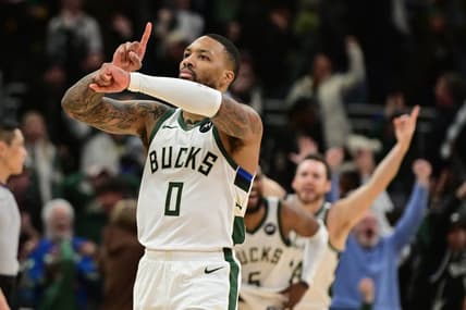 Jan 14, 2024; Milwaukee, Wisconsin, USA;  Milwaukee Bucks guard Damian Lillard (0) reacts after scoring the game-winning basket in overtime against the Sacramento Kings at Fiserv Forum. Mandatory Credit: Benny Sieu-USA TODAY Sports