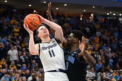 Jan 15, 2024; Milwaukee, Wisconsin, USA; Marquette Golden Eagles guard Tyler Kolek (11) takes a shot against Villanova Wildcats guard TJ Bamba (0) in the second half at Fiserv Forum. Mandatory Credit: Benny Sieu-USA TODAY Sports