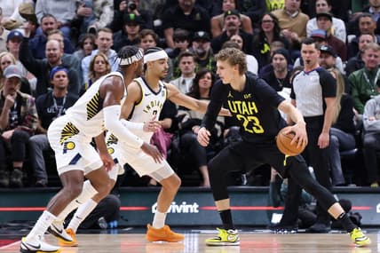 Jan 15, 2024; Salt Lake City, Utah, USA; Utah Jazz forward Lauri Markkanen (23) looks to drive against Indiana Pacers guard Buddy Hield (7) and guard Andrew Nembhard (2) during the second quarter at Delta Center. Mandatory Credit: Rob Gray-USA TODAY Sports
