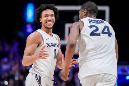Xavier Musketeers guard Desmond Claude (1) and forward Abou Ousmane (24) celebrate a basket in the second half of the NCAA Big East basketball game between the Xavier Musketeers and the Butler Bulldogs at the Cintas Center in Cincinnati on Tuesday, Jan. 16, 2024. The Musketeers won 85-71.