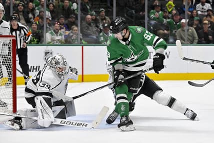 Jan 16, 2024; Dallas, Texas, USA; Los Angeles Kings goaltender Cam Talbot (39) stops a backhand shot by Dallas Stars center Wyatt Johnston (53) during the second period at the American Airlines Center. Mandatory Credit: Jerome Miron-USA TODAY Sports
