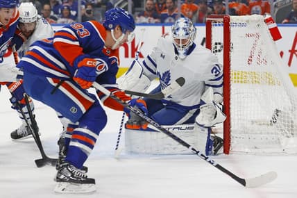 Jan 16, 2024; Edmonton, Alberta, CAN; Edmonton Oilers forward Ryan Nugent-Hopkins (93) takes a shot on Toronto Maple Leafs goaltender Martin Jones (31) during the first period at Rogers Place. Mandatory Credit: Perry Nelson-USA TODAY Sports