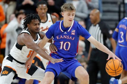 Oklahoma State Cowboys guard John-Michael Wright (51) defends Kansas Jayhawks guard Johnny Furphy (10) during a college basketball game between the Oklahoma State University Cowboys (OSU) and the Kansas Jayhawks at Gallagher-Iba Arena in Stillwater, Okla., Tuesday, Jan. 16, 2024.