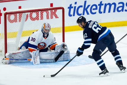 Jan 16, 2024; Winnipeg, Manitoba, CAN; New York Islanders goalie Ilya Sorokin (30) prepares for a shot by Winnipeg Jets forward Nino Niederreiter (62) during the third period at Canada Life Centre. Mandatory Credit: Terrence Lee-USA TODAY Sports