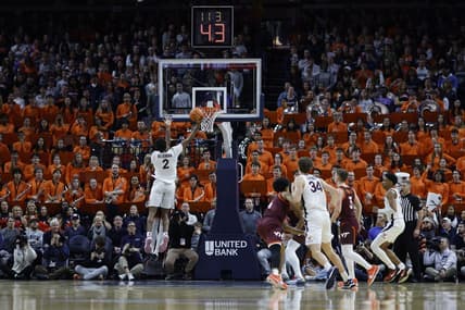 Jan 17, 2024; Charlottesville, Virginia, USA; Virginia Cavaliers guard Reece Beekman (2) shoots the ball against the Virginia Tech Hokies in the first half at John Paul Jones Arena. Mandatory Credit: Geoff Burke-USA TODAY Sports