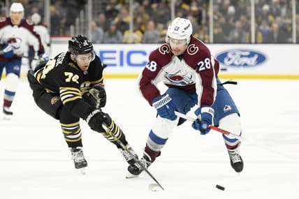 Jan 18, 2024; Boston, Massachusetts, USA; Colorado Avalanche left wing Miles Wood (28) controls the puck while Colorado Avalanche right wing Alex Beaucage (74) defends during the second period at TD Garden. Mandatory Credit: Bob DeChiara-USA TODAY Sports