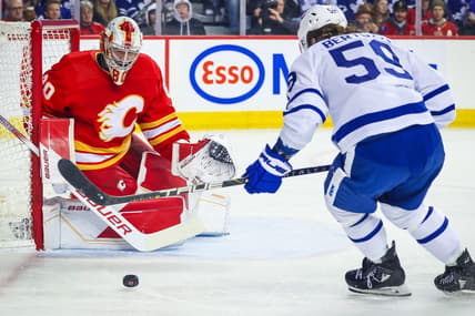 Jan 18, 2024; Calgary, Alberta, CAN; Calgary Flames goaltender Dan Vladar (80) guards his net against Toronto Maple Leafs left wing Tyler Bertuzzi (59) during the first period at Scotiabank Saddledome. Mandatory Credit: Sergei Belski-USA TODAY Sports