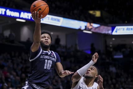 Jan 19, 2024; Cincinnati, Ohio, USA; Georgetown Hoyas guard Jayden Epps (10) shoots against Xavier Musketeers guard Dayvion McKnight (20) in the second half at Cintas Center. Mandatory Credit: Katie Stratman-USA TODAY Sports