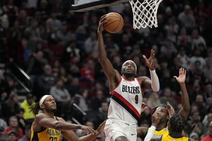 Jan 19, 2024; Portland, Oregon, USA; Portland Trail Blazers small forward Jerami Grant (9) shoots the ball past Indiana Pacers small forward Aaron Nesmith (23, right) during the second half at Moda Center. Mandatory Credit: Soobum Im-USA TODAY Sports