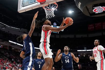Jan 20, 2024; Columbus, Ohio, USA; Ohio State Buckeyes guard Evan Mahaffey (12) shoots around Penn State Nittany Lions guard Nick Kern Jr. (3) during the NCAA men   s basketball game at Value City Arena.