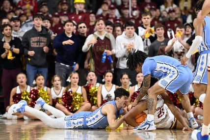 Jan 20, 2024; Chestnut Hill, Massachusetts, USA; North Carolina Tar Heels guard Cormac Ryan (3) and Boston College Eagles forward Devin McGlockton (21) battle for the ball during the first half at Conte Forum. Mandatory Credit: Eric Canha-USA TODAY Sports