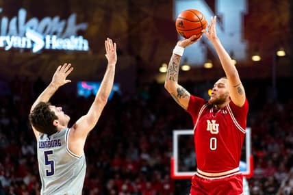 Jan 20, 2024; Lincoln, Nebraska, USA; Nebraska Cornhuskers guard C.J. Wilcher (0) shoots a three-point shot against Northwestern Wildcats guard Ryan Langborg (5) during the first half at Pinnacle Bank Arena. Mandatory Credit: Dylan Widger-USA TODAY Sports