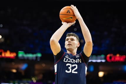 Jan 20, 2024; Philadelphia, Pennsylvania, USA; Connecticut Huskies center Donovan Clingan (32) shoots the ball against the Villanova Wildcats during the first half at Wells Fargo Center. Mandatory Credit: Bill Streicher-USA TODAY Sports