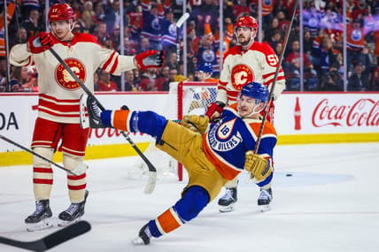 Jan 20, 2024; Calgary, Alberta, CAN; Edmonton Oilers left wing Zach Hyman (18) scores a goal against Calgary Flames during the third period at Scotiabank Saddledome. Mandatory Credit: Sergei Belski-USA TODAY Sports