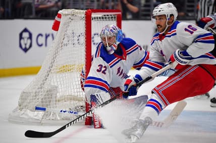 Jan 20, 2024; Los Angeles, California, USA; New York Rangers center Vincent Trocheck (16) helps goaltender Jonathan Quick (32) defend the goal against the Los Angeles Kings durng the second period at Crypto.com Arena. Mandatory Credit: Gary A. Vasquez-USA TODAY Sports