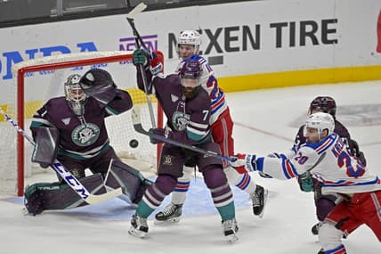 Jan 21, 2024; Anaheim, California, USA; Anaheim Ducks goaltender Lukas Dostal (1) looks to make a glove save off a shot by New York Rangers left wing Chris Kreider (20) as Anaheim Ducks defenseman Radko Gudas (7) and New York Rangers right wing Kaapo Kakko (24) battle in front of the net in the first period at Honda Center. Mandatory Credit: Jayne Kamin-Oncea-USA TODAY Sports
