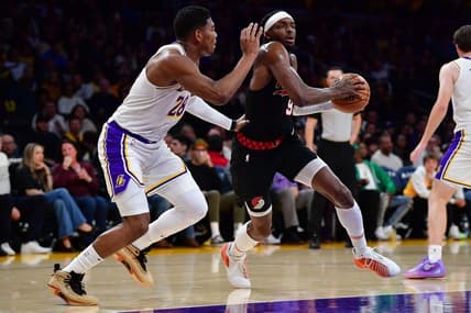 Jan 21, 2024; Los Angeles, California, USA; Portland Trail Blazers forward Jerami Grant (9) moves the ball against Los Angeles Lakers forward Rui Hachimura (28) during the first half at Crypto.com Arena. Mandatory Credit: Gary A. Vasquez-USA TODAY Sports