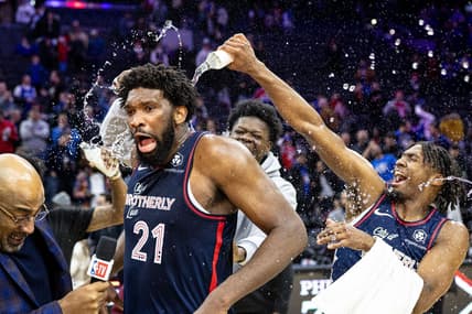 Jan 22, 2024; Philadelphia, Pennsylvania, USA; Philadelphia 76ers center Joel Embiid (21) is doused with water by teammates after scoring 70 points in a victory against the San Antonio Spurs at Wells Fargo Center. Mandatory Credit: Bill Streicher-USA TODAY Sports