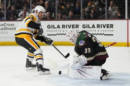Jan 22, 2024; Tempe, Arizona, USA; Arizona Coyotes goaltender Connor Ingram (39) makes the save on Pittsburgh Penguins center Sidney Crosby (87) in the first period at Mullett Arena. Mandatory Credit: Rick Scuteri-USA TODAY Sports