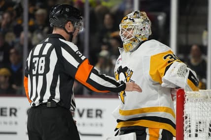 Jan 22, 2024; Tempe, Arizona, USA; Pittsburgh Penguins goaltender Tristan Jarry (35) talks to NHL referee Peter McDougall during a timeout in the second period against the Arizona Coyotes at Mullett Arena. Mandatory Credit: Rick Scuteri-USA TODAY Sports