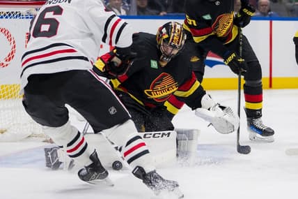 Jan 22, 2024; Vancouver, British Columbia, CAN; Vancouver Canucks goalie Thatcher Demko (35) makes a save on Chicago Blackhawks forward Jason Dickinson (16) in the second period at Rogers Arena. Mandatory Credit: Bob Frid-USA TODAY Sports