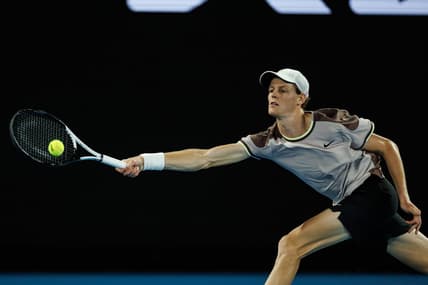Jan 23, 2024; Melbourne, Victoria, Australia;  Jannik Sinner of Italy in action against Andrey Rublev of Russia in the quarter final of the men s singles. Mandatory Credit: Mike Frey-USA TODAY Sports