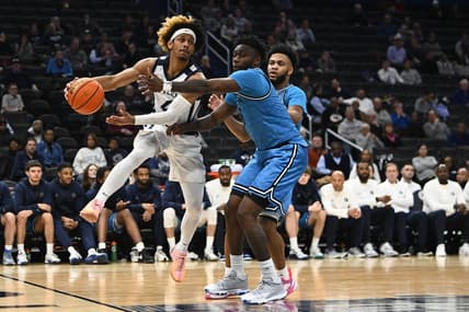 Jan 23, 2024; Washington, District of Columbia, USA; Butler Bulldogs guard DJ Davis (4) passes around Georgetown Hoyas guard Jay Heath (5) during the first half at Capital One Arena. Mandatory Credit: Brad Mills-USA TODAY Sports
