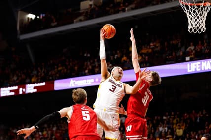 Jan 23, 2024; Minneapolis, Minnesota, USA; Minnesota Golden Gophers forward Dawson Garcia (3) shoots as Wisconsin Badgers forward Nolan Winter (31) defends during the first half at Williams Arena. Mandatory Credit: Matt Krohn-USA TODAY Sports