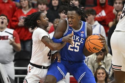 Jan 23, 2024; Louisville, Kentucky, USA;  Duke Blue Devils forward Mark Mitchell (25) posts up against Louisville Cardinals guard Ty-Laur Johnson (4) during the second half at KFC Yum! Center. Duke defeated Louisville 83-69. Mandatory Credit: Jamie Rhodes-USA TODAY Sports