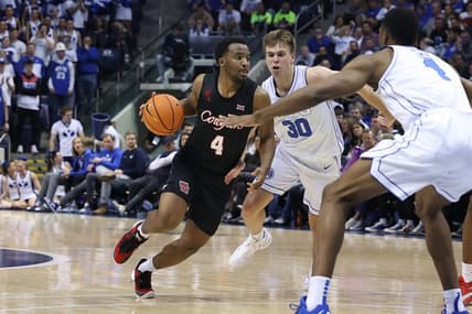 Jan 23, 2024; Provo, Utah, USA; Houston Cougars guard L.J. Cryer (4) dribbles past Brigham Young Cougars guard Dallin Hall (30) during the first half at Marriott Center. Mandatory Credit: Rob Gray-USA TODAY Sports