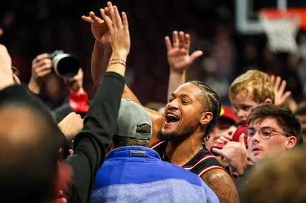 Jan 23, 2024; Columbia, South Carolina, USA; South Carolina Gamecocks guard Ta'Lon Cooper (55) celebrates with students after beating the Kentucky Wildcats at Colonial Life Arena. Mandatory Credit: Jeff Blake-USA TODAY Sports